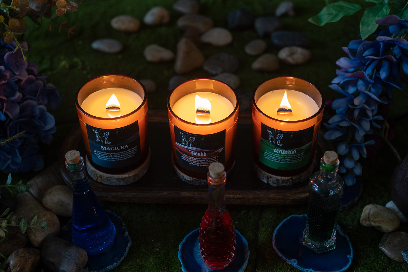 three glowing, lit potions candles from Mythologie's RPG line