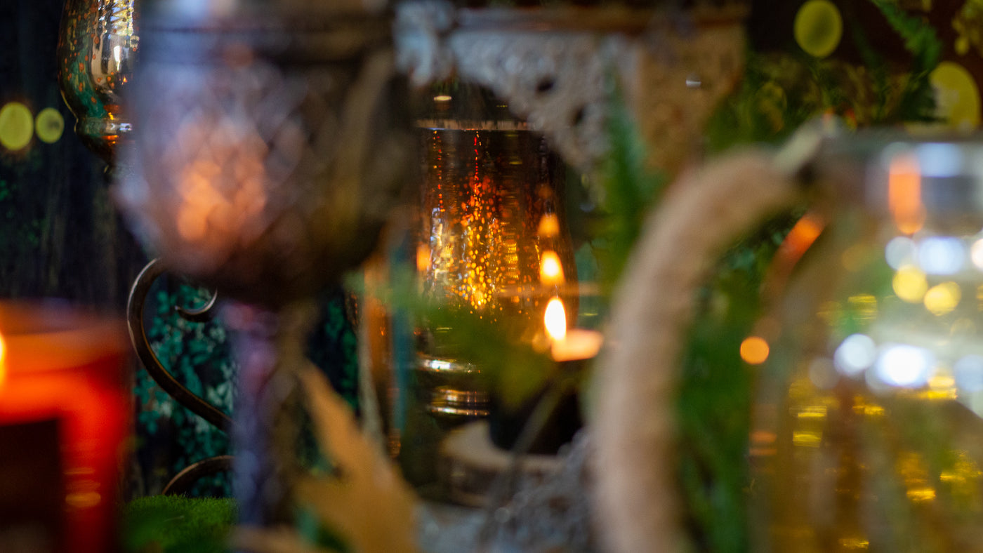 candle background goblets, greenery, elvish things