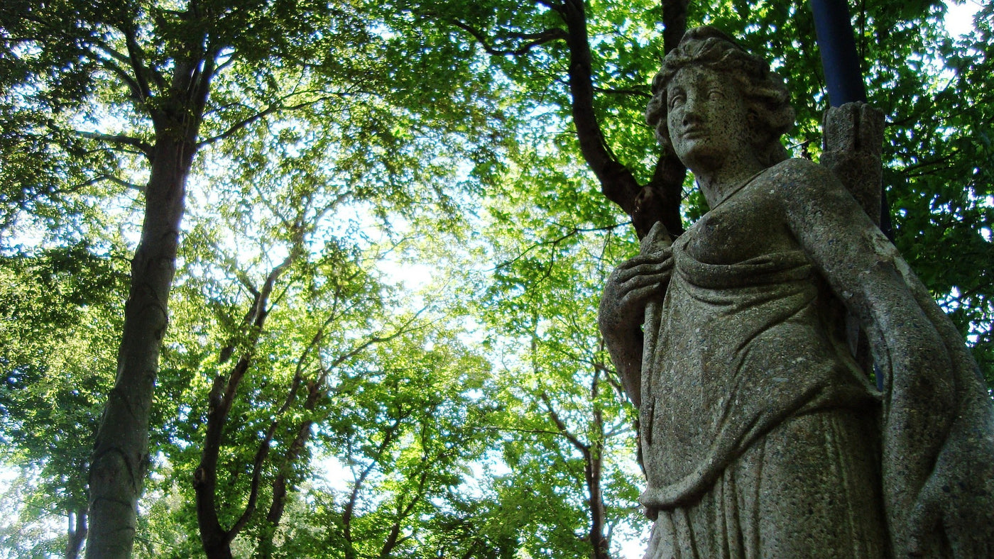 statue of artemis in the woods