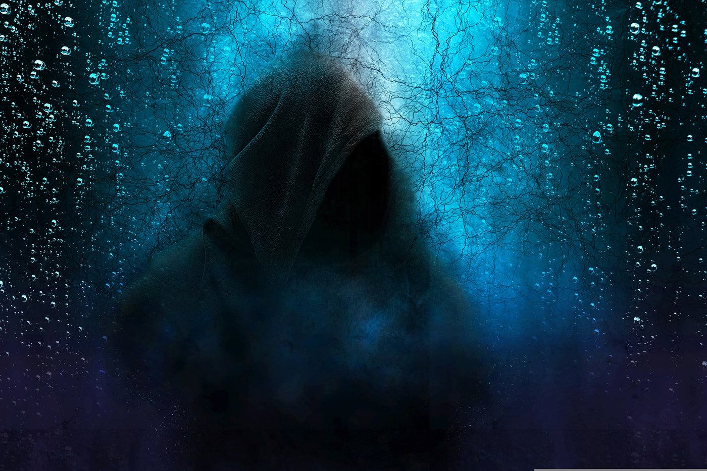 hooded figure in the dark